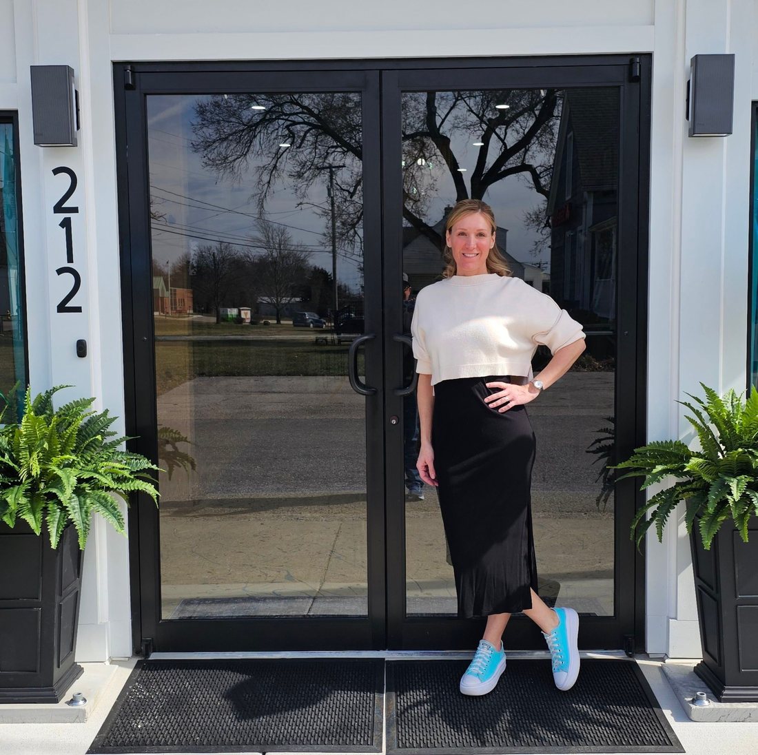 Crystal, owner and instructor, in front of the studio at 212 W. Pearce Blvd.